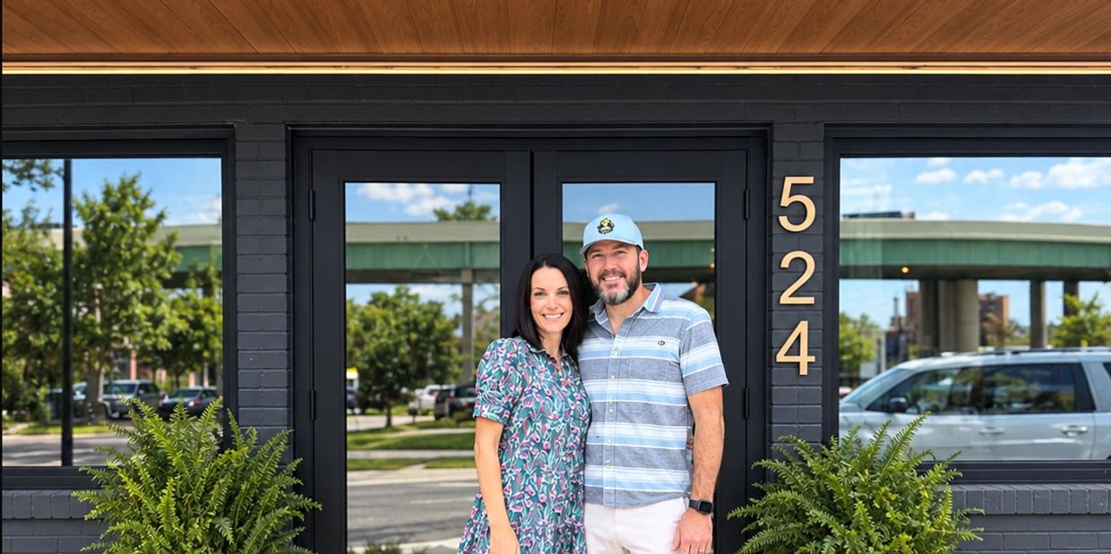 Couple standing outside a building with number 524.