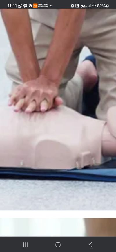 Person performing CPR on a training mannequin.