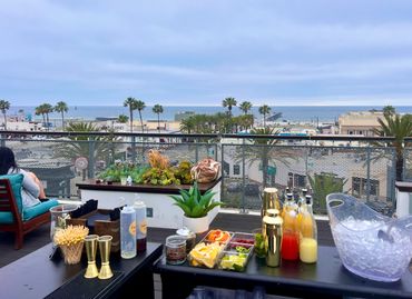 Mobile bar at rooftop event with a great view