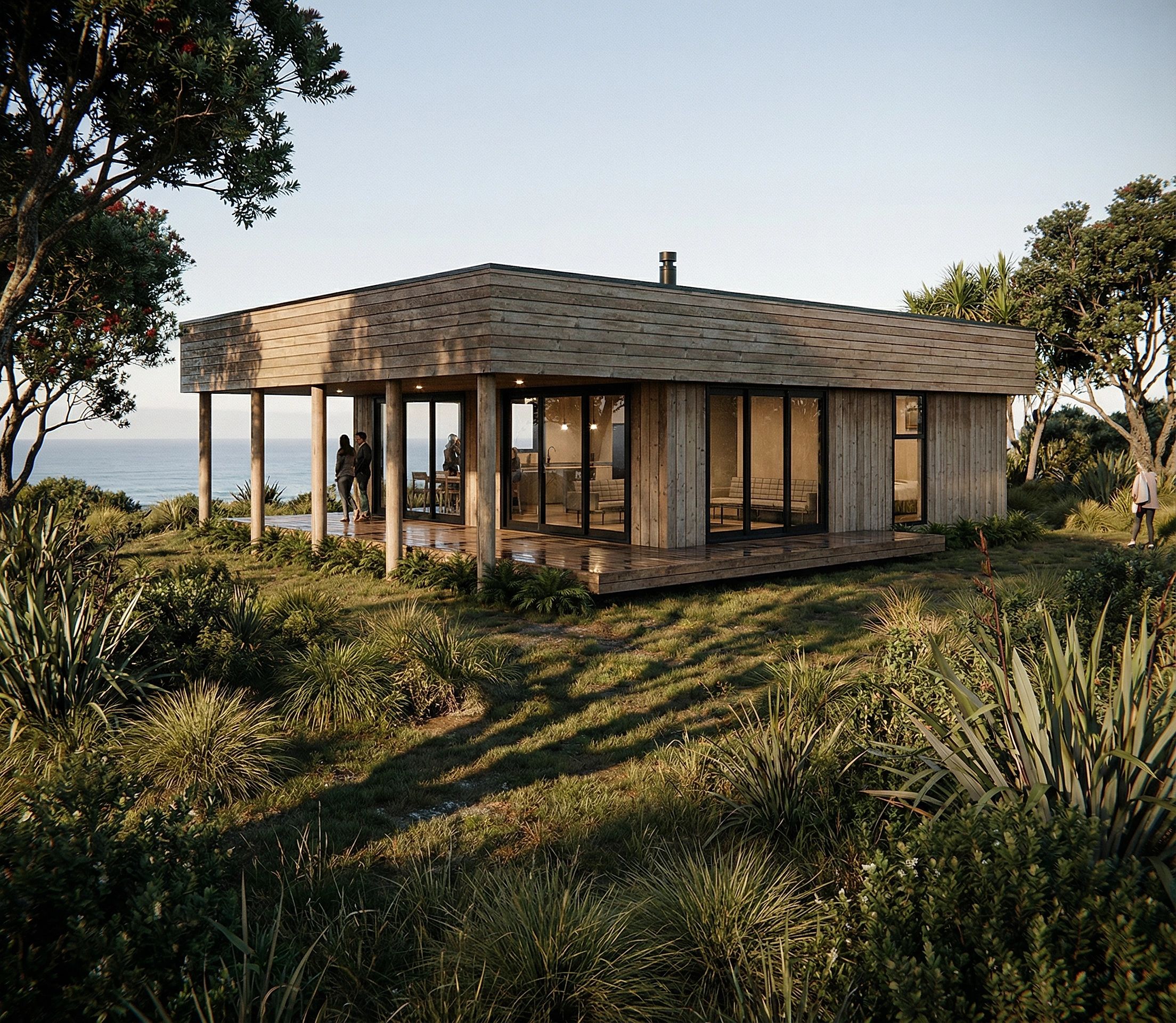 Modern wooden house with glass walls surrounded by greenery and sea view.