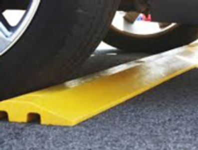 Yellow plastic speed bump