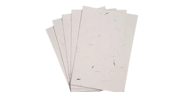 Stack of handmade textured paper sheets with natural fibers.