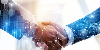 2 men shaking hands with hexagon overlay