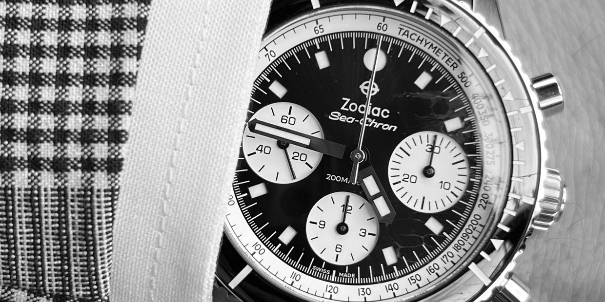 Close-up of a Zodiac Sea-Chron wristwatch on a wrist.