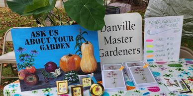 table with sign asking for gardening questions