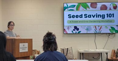 woman making presentation about benefits of seed saving