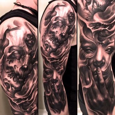 Surreal black and gray tattoo sleeve featuring a mysterious face and abstract skulls.
