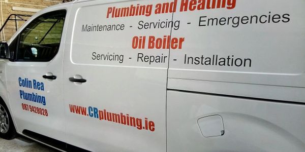 Photograph of a white van with the services and contact details of Colin Rea Plumbing