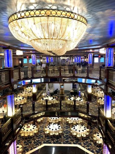 Interior of Majesty yacht, two stories, open atrium, large chandelier