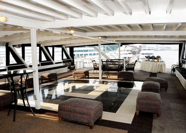 Top deck of Destiny, sides are open to the sir, tables and lounge chairs