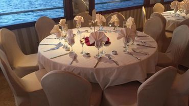 Table for ten, set with tablecloth and place settings