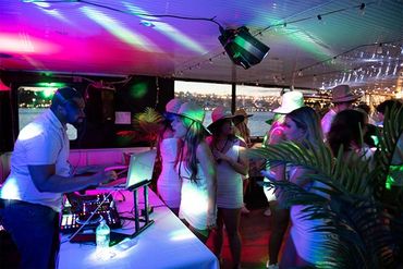 Deejay and guests dancing aboard Emerald Princess yacht