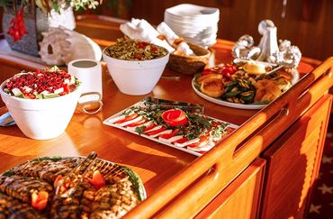Various bowls and platters of food