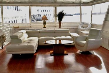 Sundancer aft lounge, white leather couches
