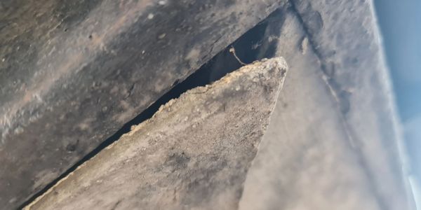 A photo of asbestos soffits timber fascia on a house.