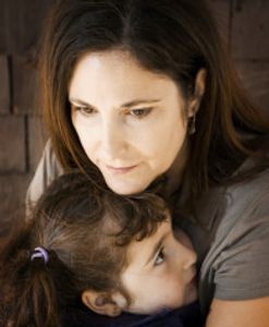 Mother with small child looking worried. Divorce and Custody