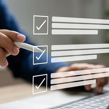 Person checking off tasks on a digital checklist with a stylus pen.