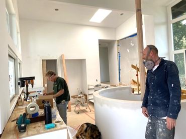 custom kitchen design. sheetrocking round staircase.