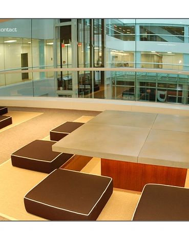 Concrete meeting and lunch tables at FCB advertising. sunken tables and custom concrete.