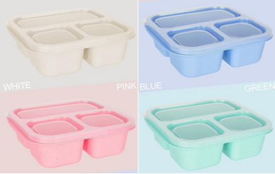 Four eco-friendly, compartmentalized food trays in white, blue, pink, and green.
