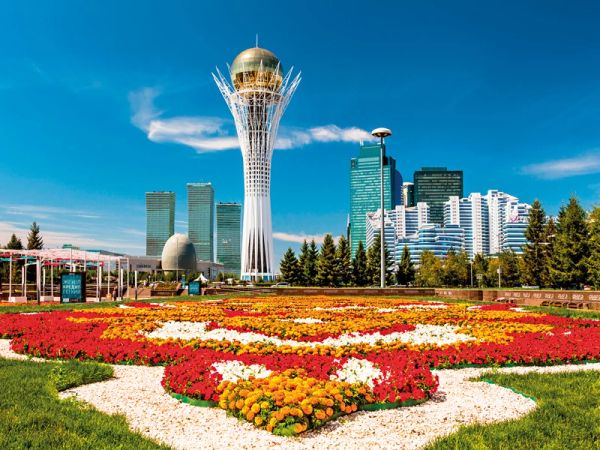 Baiterek Tower with colorful flowerbed in Nur-Sultan city.