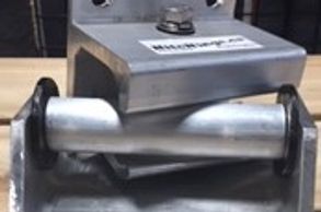 Aluminum Hitch and Hinge connected with black background on a wood table.