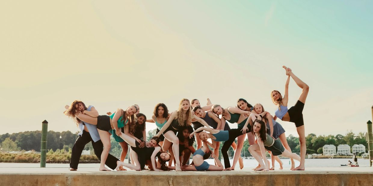 RDC competition team posing by the New River for their 2025 photoshoot with Alley Photography