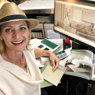 Abby Vasek, Interior designer at desk