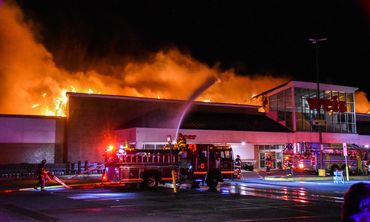 An assist to station 183 for an engine, truck, and manpower on a 4 alarm commercial structure fire.