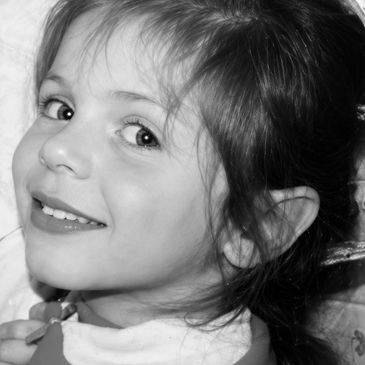 Smiling young girl looking at the camera.