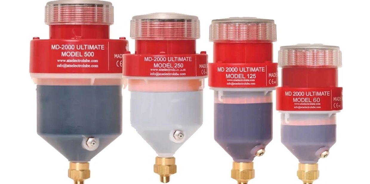 Four red and gray MD-2000 Ultimate lubricant dispensers of different sizes.