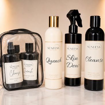 Skincare products from Sunless Sanctuary displayed on a marble surface.