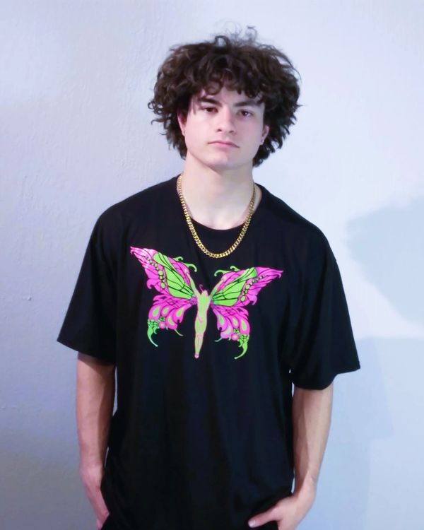 The Black Zymyrgy promotional T-shirt. Featuring a vibrant Monarch Man design on a 100% cotton Next