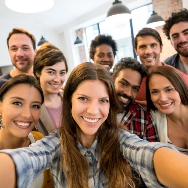 Group selfie with smiling diverse friends.