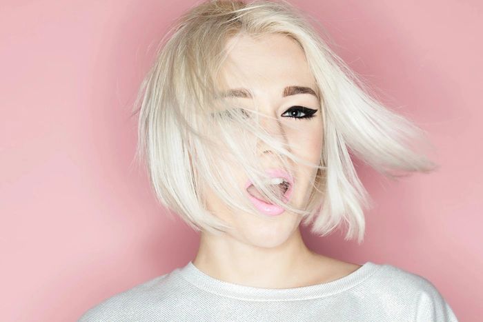 a woman with short blonde hair