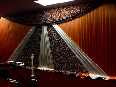 elegant event lighting, ceiling draping, sophisticated ambience, luxury wedding designs