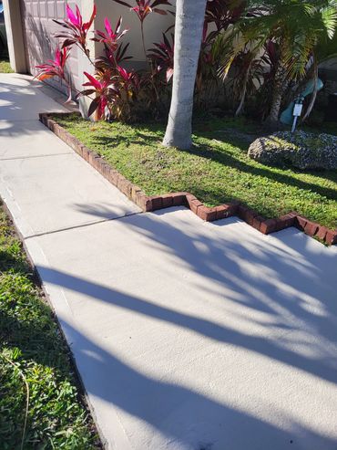 walkway to house in Miami after pressure washing services