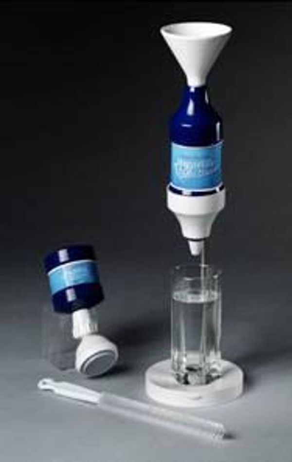 Water purification device with a blue bottle filtering water into a glass.