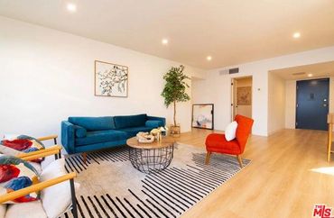 Bright living room with colorful furniture and modern decor.