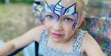 Young girl with colorful butterfly face paint and a pink bow.