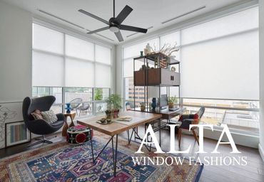 Modern office with large windows and white roller shades by Alta Window Fashions.