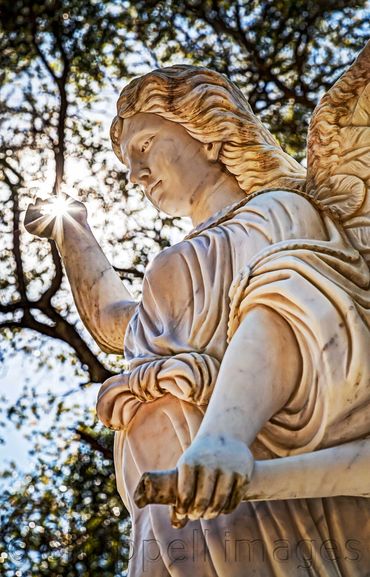 Cemetery Angel Statuary - lens flair.  Amelia Island,  FL