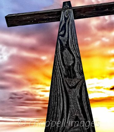 Resurrection Cross against a golden sunrise