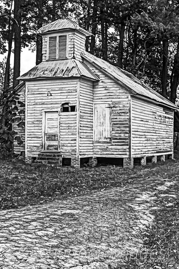 Run down Church-like building stands in clearing