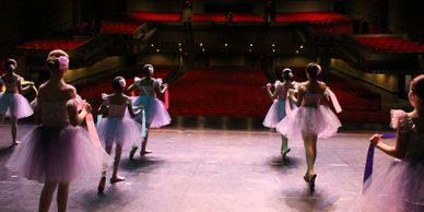 ballet dancers looking out to the audience