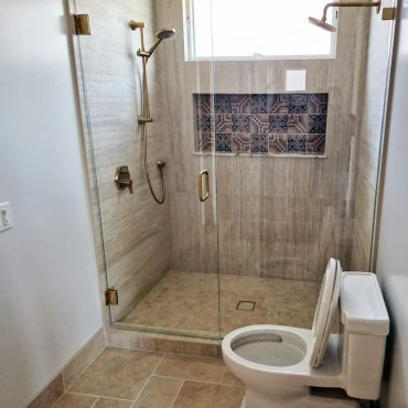 Bathroom pluming project included shower appliances, toilet and sink.