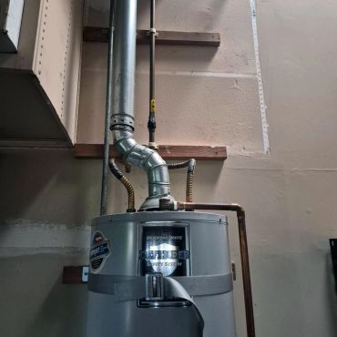 Water heater installment with copper pipes.