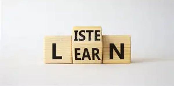Wooden blocks spell out 'LEARN' with interchangeable middle blocks.