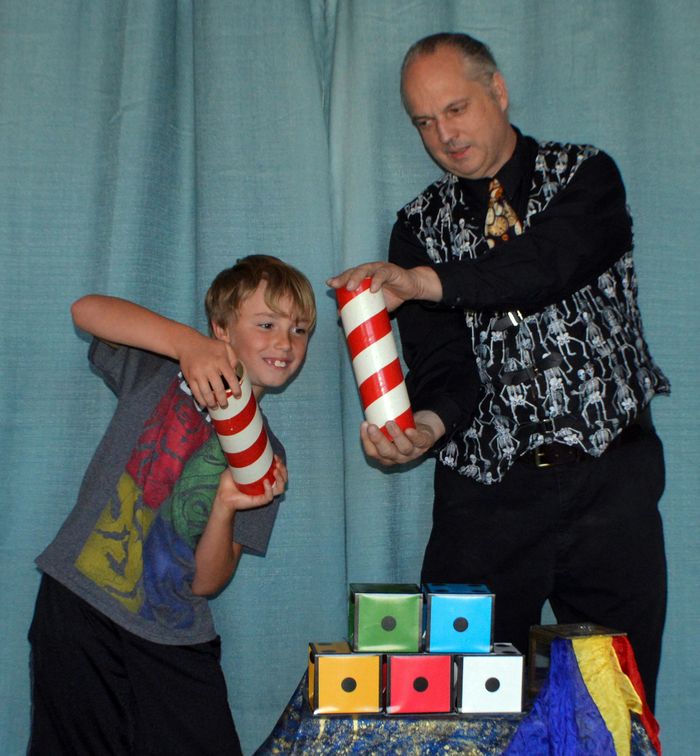 Performing the audience participation comedy magic trick Topsy Turvy Bottles with my great nephew.