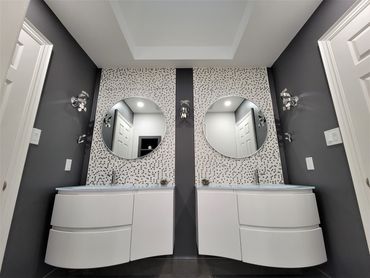 His and Hers!  Stunning mosaic accent wall, which carries into the tub niche.  Modern and Poshy!